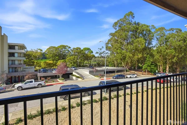 a view of a street with cars