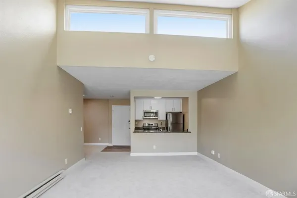 a view of a kitchen with a sink and cabinets