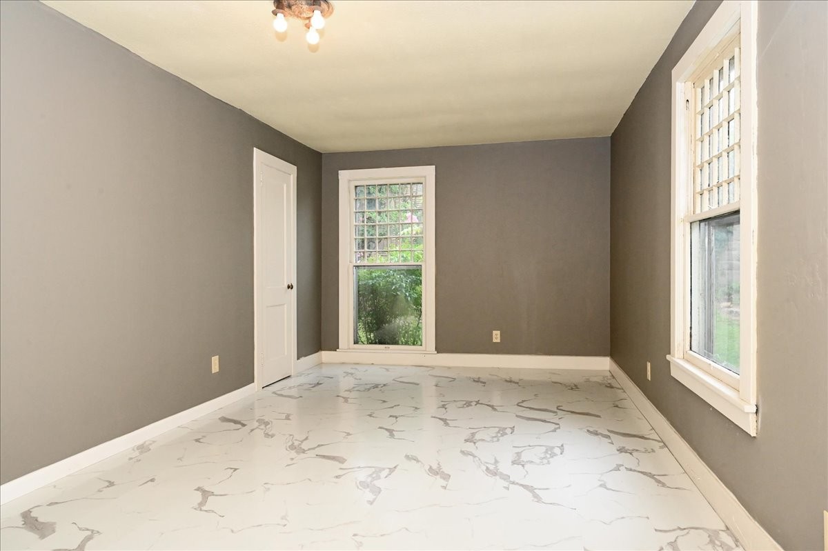 426 Sherman Street Southeast Decatur, AL 35601 - Photo 19 of 41 a view of a big room with windows and closet