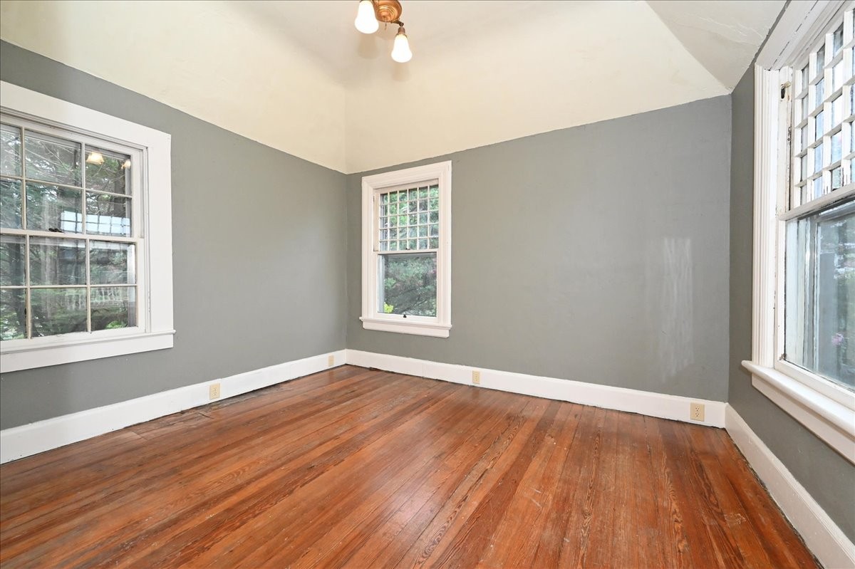 426 Sherman Street Southeast Decatur, AL 35601 - Photo 31 of 41 a view of an empty room with wooden floor and a window