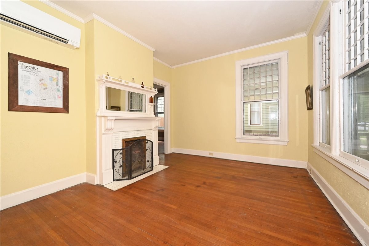 426 Sherman Street Southeast Decatur, AL 35601 - Photo 5 of 41 a view of a livingroom with a fireplace and window