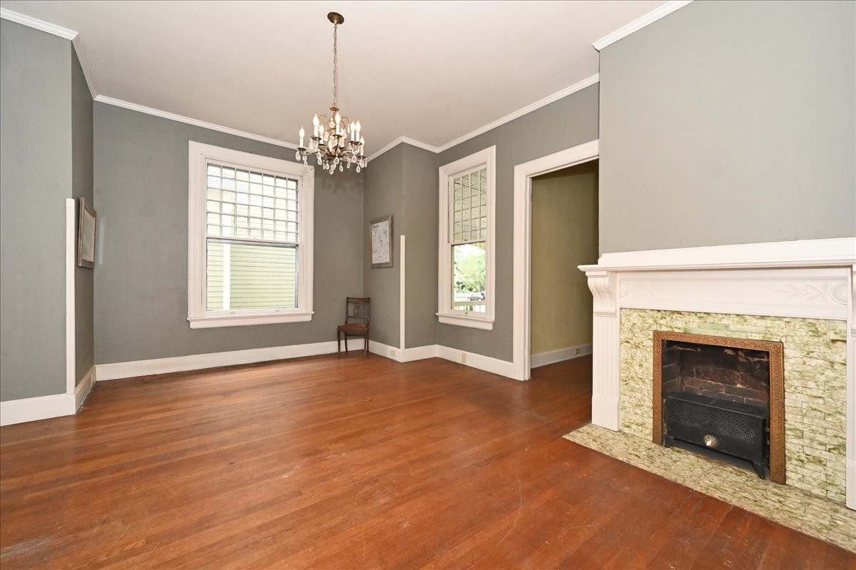 426 Sherman Street Southeast Decatur, AL 35601 - Photo 9 of 41 a view of an empty room with window and fire place