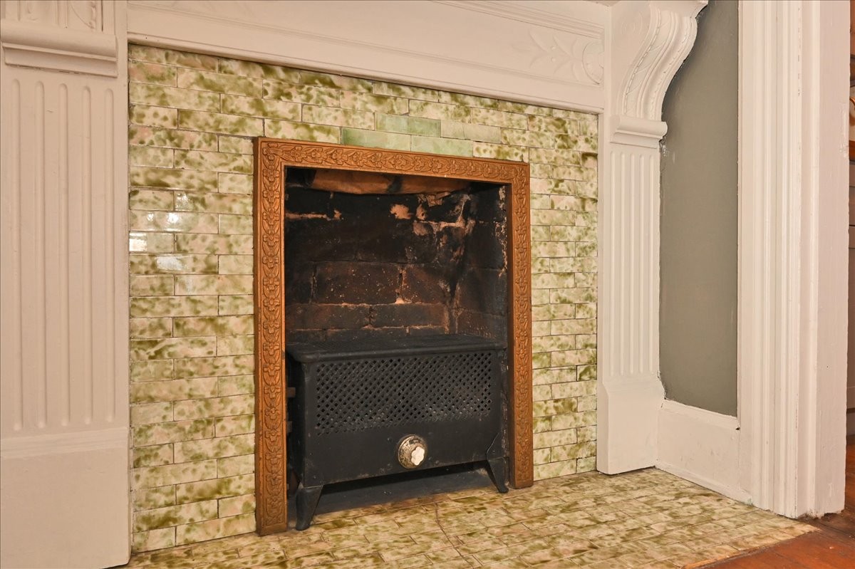 426 Sherman Street Southeast Decatur, AL 35601 - Photo 10 of 41 a room with a fireplace and a table