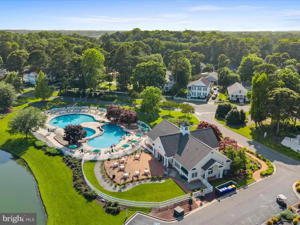 an aerial view of residential house with outdoor space and swimming pool