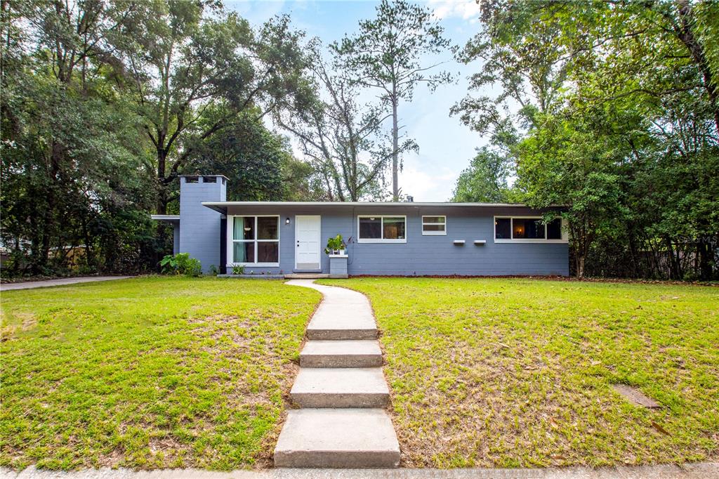 517 Northwest 35th Street Gainesville, FL 32607 - Photo 1 of 1 a front view of a house with a swimming pool