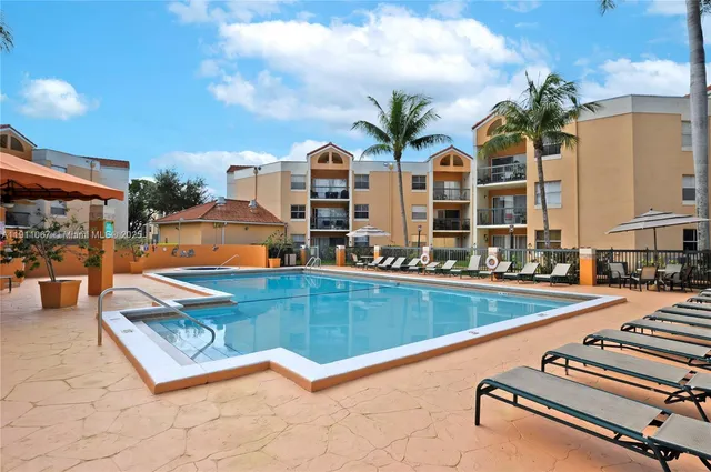 swimming pool with outdoor seating and yard