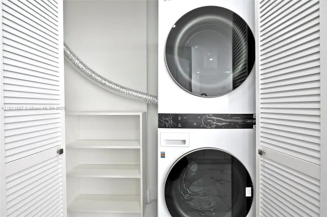 a view of a hallway with washer and dryer