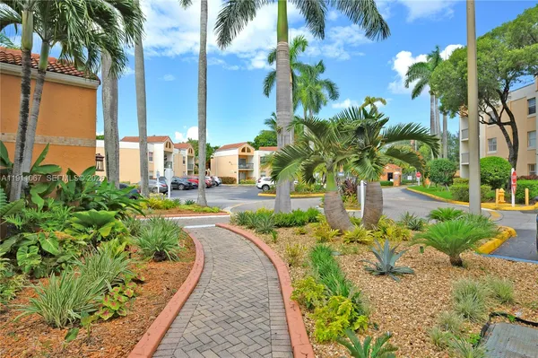 a view of a garden with a fountain
