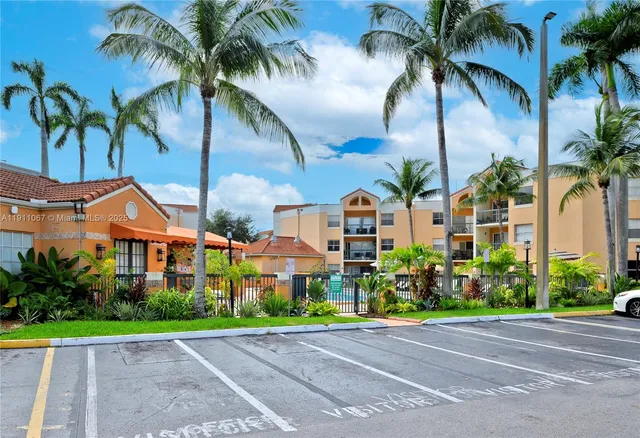 a view of a multi story palm trees