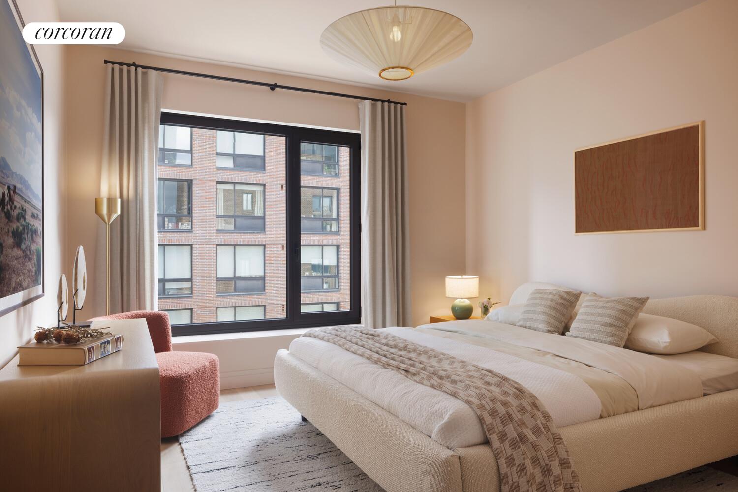 428 West 19th Street, Unit 8A Manhattan, NY 10011 - Photo 4 of 18 a bedroom with a bed and a large window