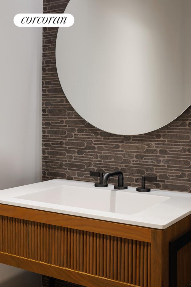 428 West 19th Street, Unit 8A Manhattan, NY 10011 - Photo 9 of 18 a bathroom with a sink and a mirror