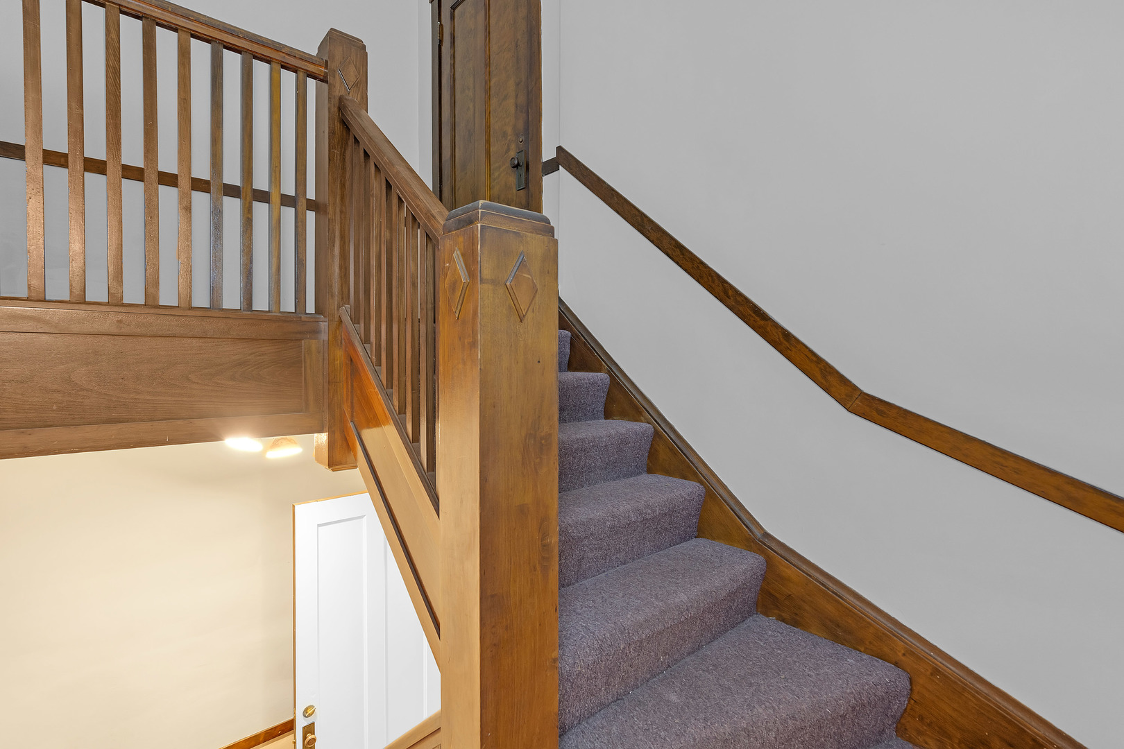 6138 North Meade Avenue Chicago, IL 60646 - Photo 14 of 32 a view of staircase with wooden floor and white walls