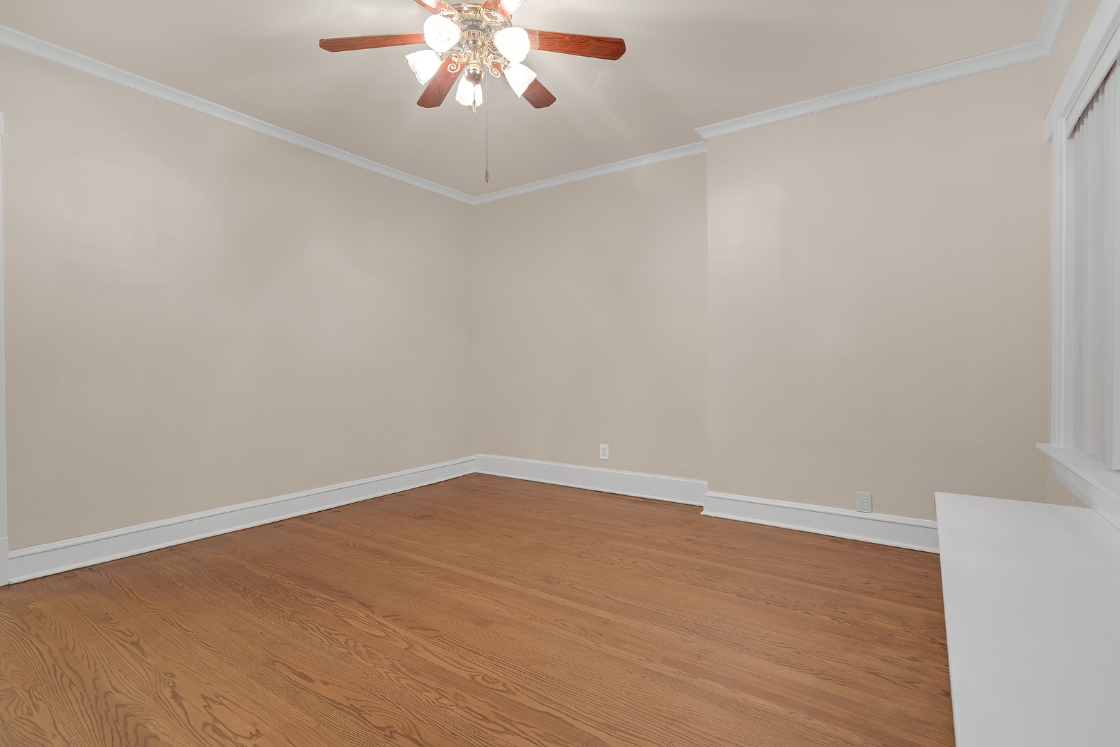6138 North Meade Avenue Chicago, IL 60646 - Photo 7 of 32 a view of an empty room with a chandelier fan