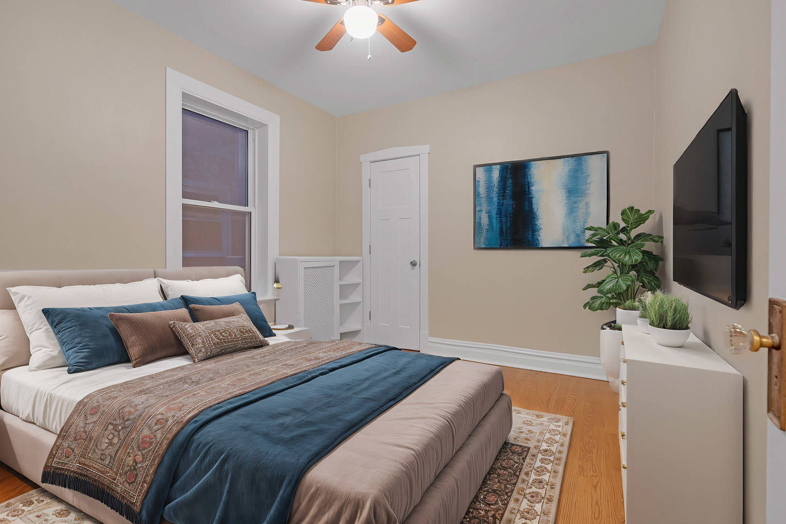 6138 North Meade Avenue Chicago, IL 60646 - Photo 9 of 32 a bedroom with a bed and a potted plant