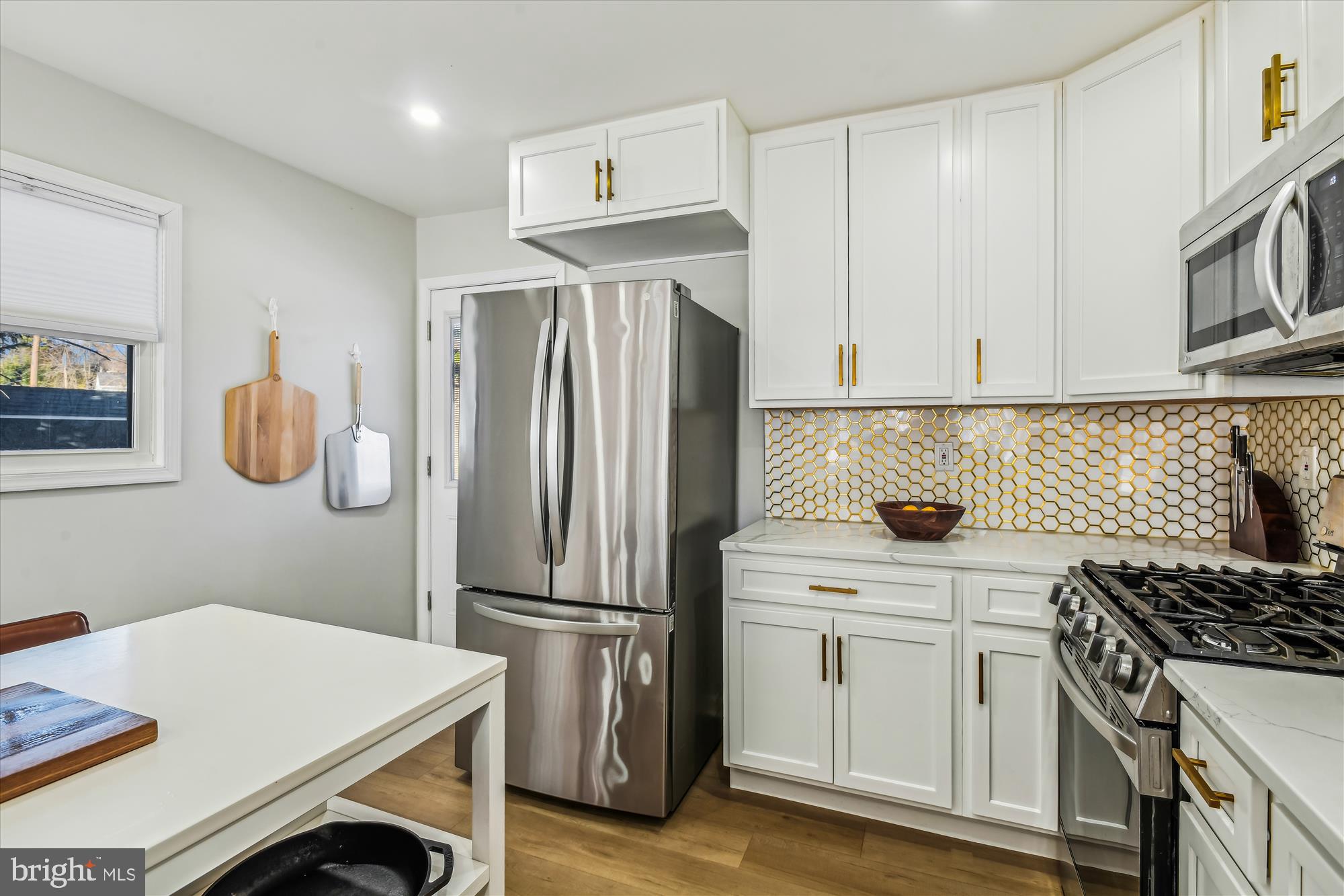 232 Candytuft Road Reisterstown, MD 21136 - Photo 9 of 42 a kitchen with a refrigerator sink and stove