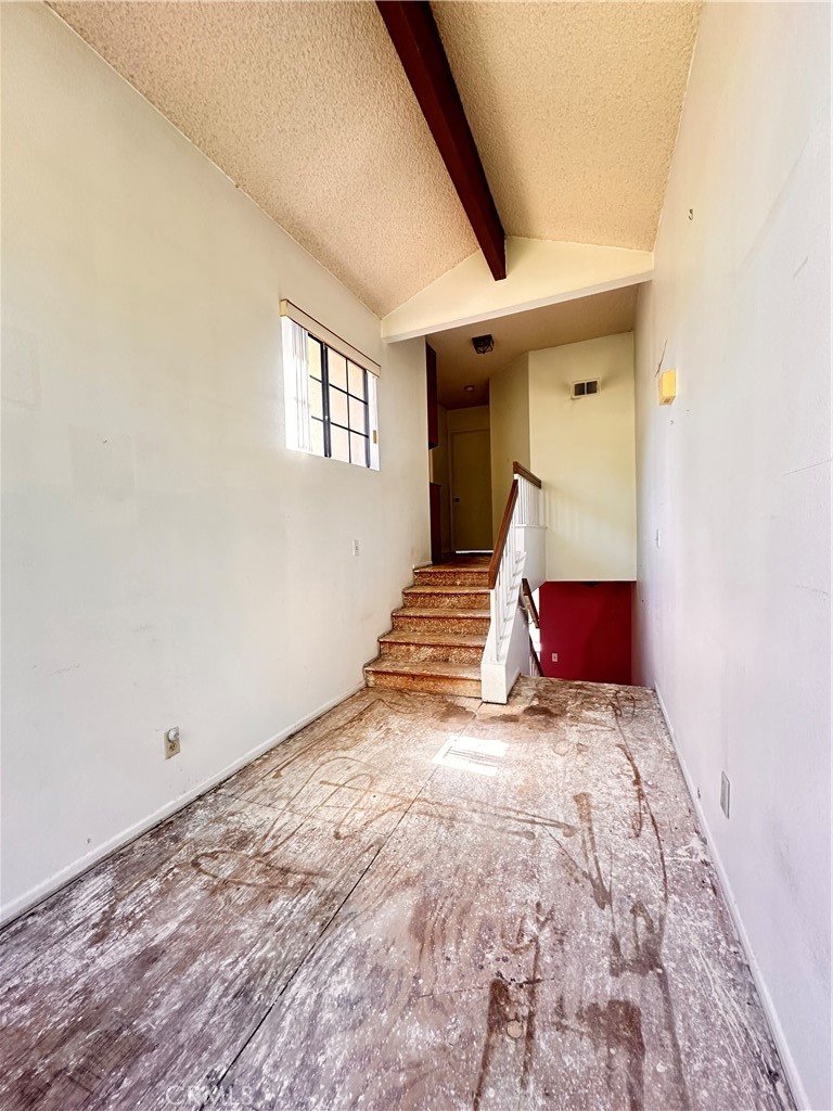 7 Wilderness Place Pomona, CA 91766 - Photo 14 of 26 a view of empty room with wooden floor and fan