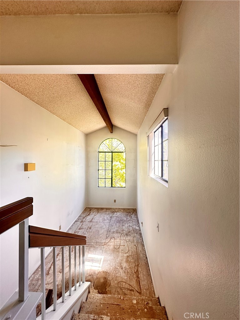 7 Wilderness Place Pomona, CA 91766 - Photo 15 of 26 a view of a hallway with windows