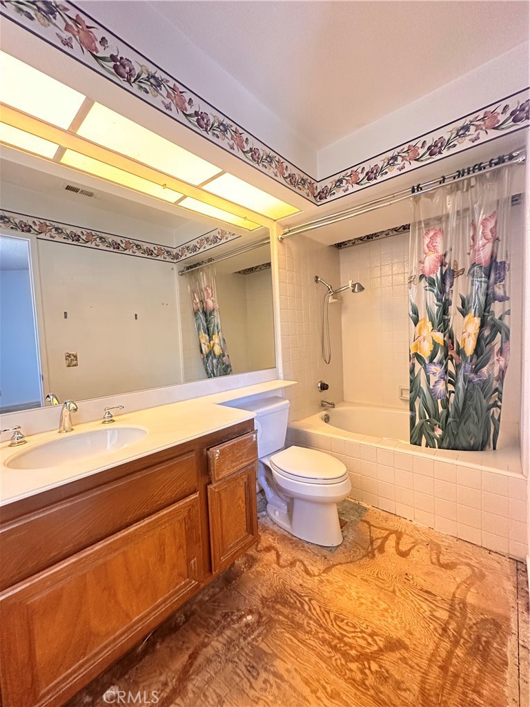 7 Wilderness Place Pomona, CA 91766 - Photo 19 of 26 a bathroom with a sink a toilet and shower