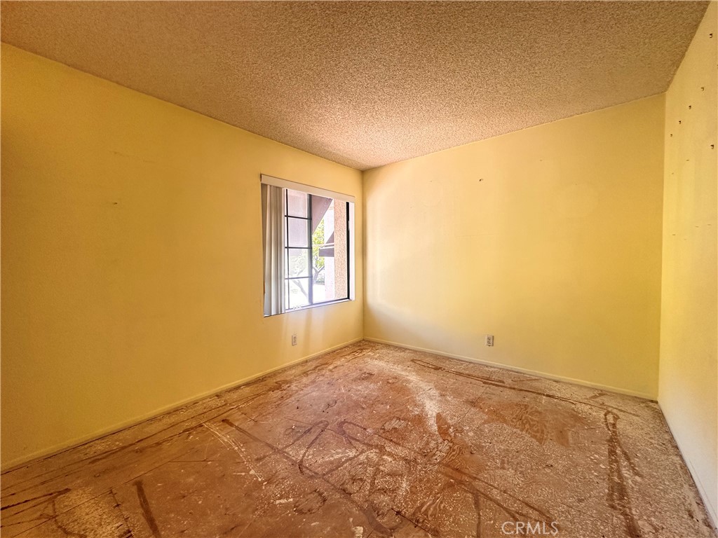 7 Wilderness Place Pomona, CA 91766 - Photo 21 of 26 a view of an empty room and window