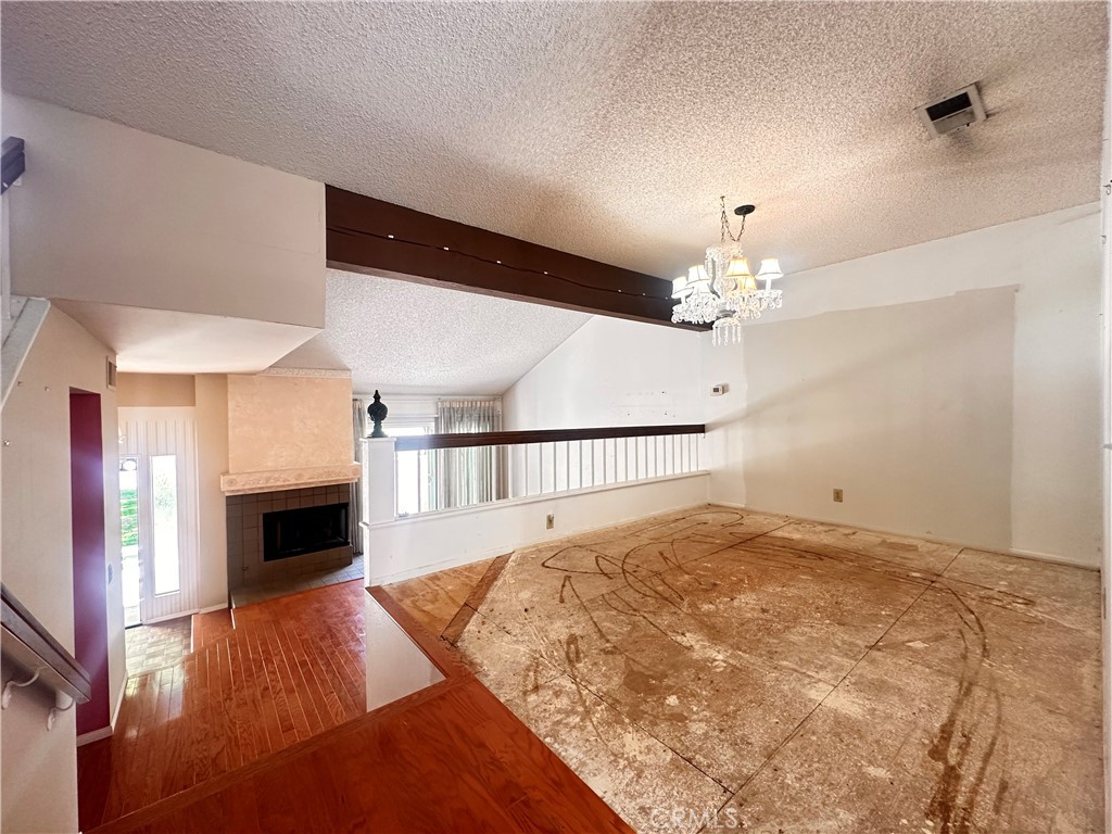 7 Wilderness Place Pomona, CA 91766 - Photo 9 of 26 a view of a livingroom with a fireplace