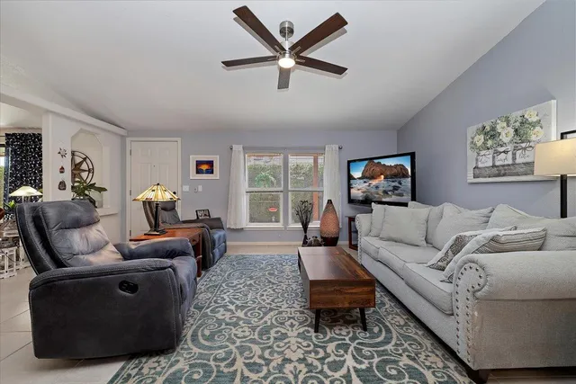 a living room with furniture and a window