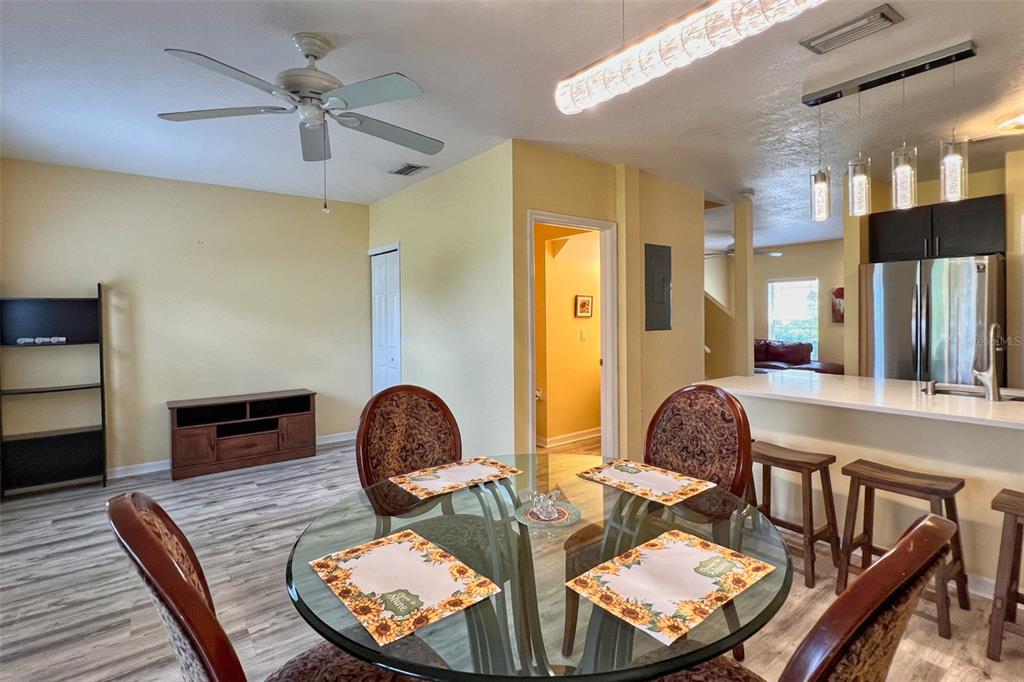 14741 Amberjack Terrace Lakewood Ranch, FL 34202 - Photo 12 of 48 a living room with furniture a fireplace and a flat screen tv