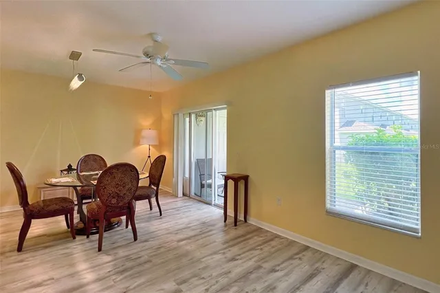 a dining room with furniture and window