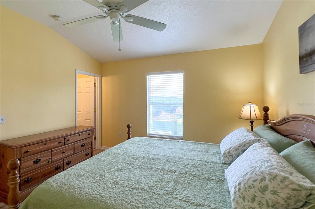 14741 Amberjack Terrace Lakewood Ranch, FL 34202 - Photo 21 of 48 a bedroom with a bed and a flat tv screen on dresser
