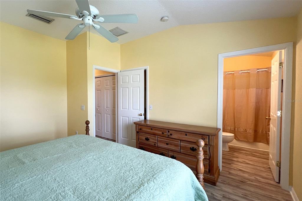 14741 Amberjack Terrace Lakewood Ranch, FL 34202 - Photo 23 of 48 a bedroom with a bed and wooden floor