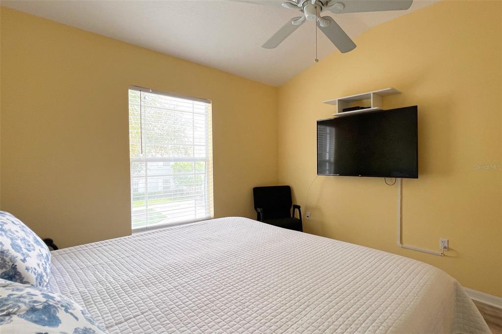 14741 Amberjack Terrace Lakewood Ranch, FL 34202 - Photo 27 of 48 a bedroom with a bed and a flat screen tv