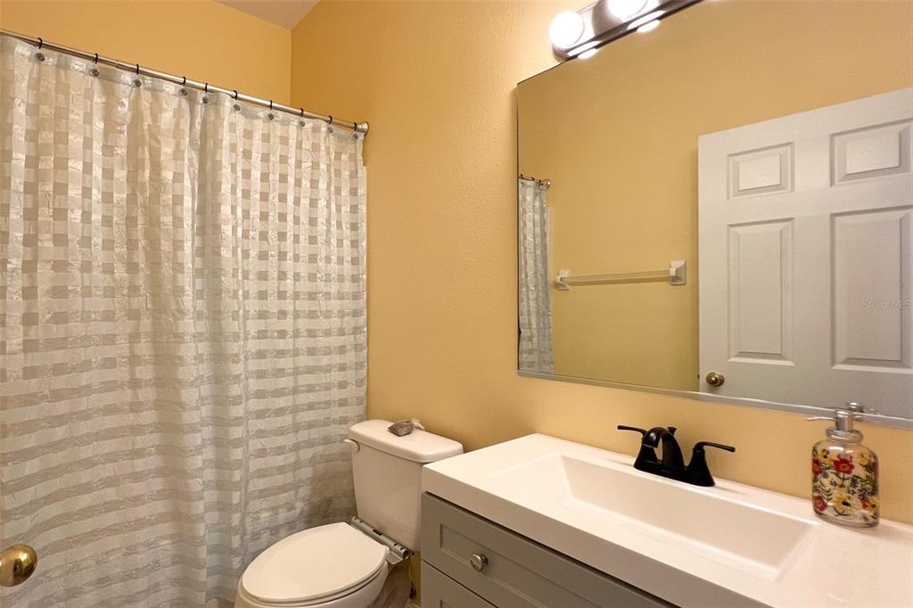 14741 Amberjack Terrace Lakewood Ranch, FL 34202 - Photo 29 of 48 a bathroom with a sink a toilet and a mirror