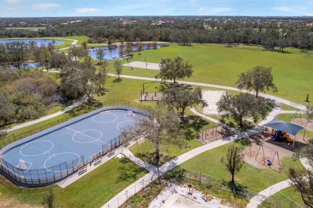 14741 Amberjack Terrace Lakewood Ranch, FL 34202 - Photo 42 of 48 a view of a lake with a yard
