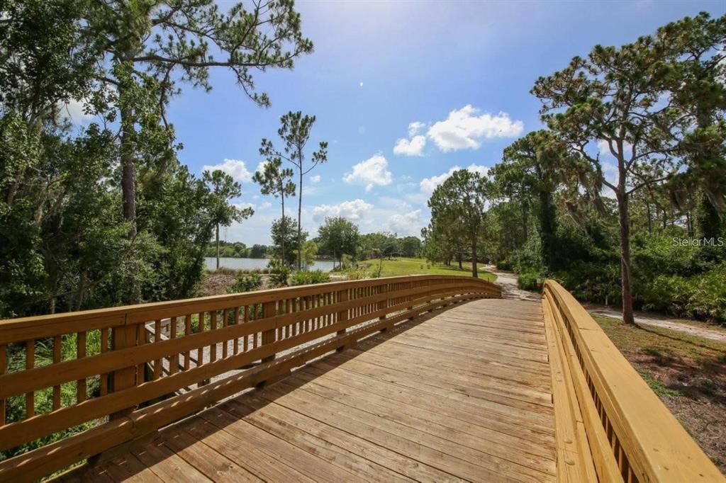 14741 Amberjack Terrace Lakewood Ranch, FL 34202 - Photo 48 of 48 a view of a balcony with wooden floor and fence