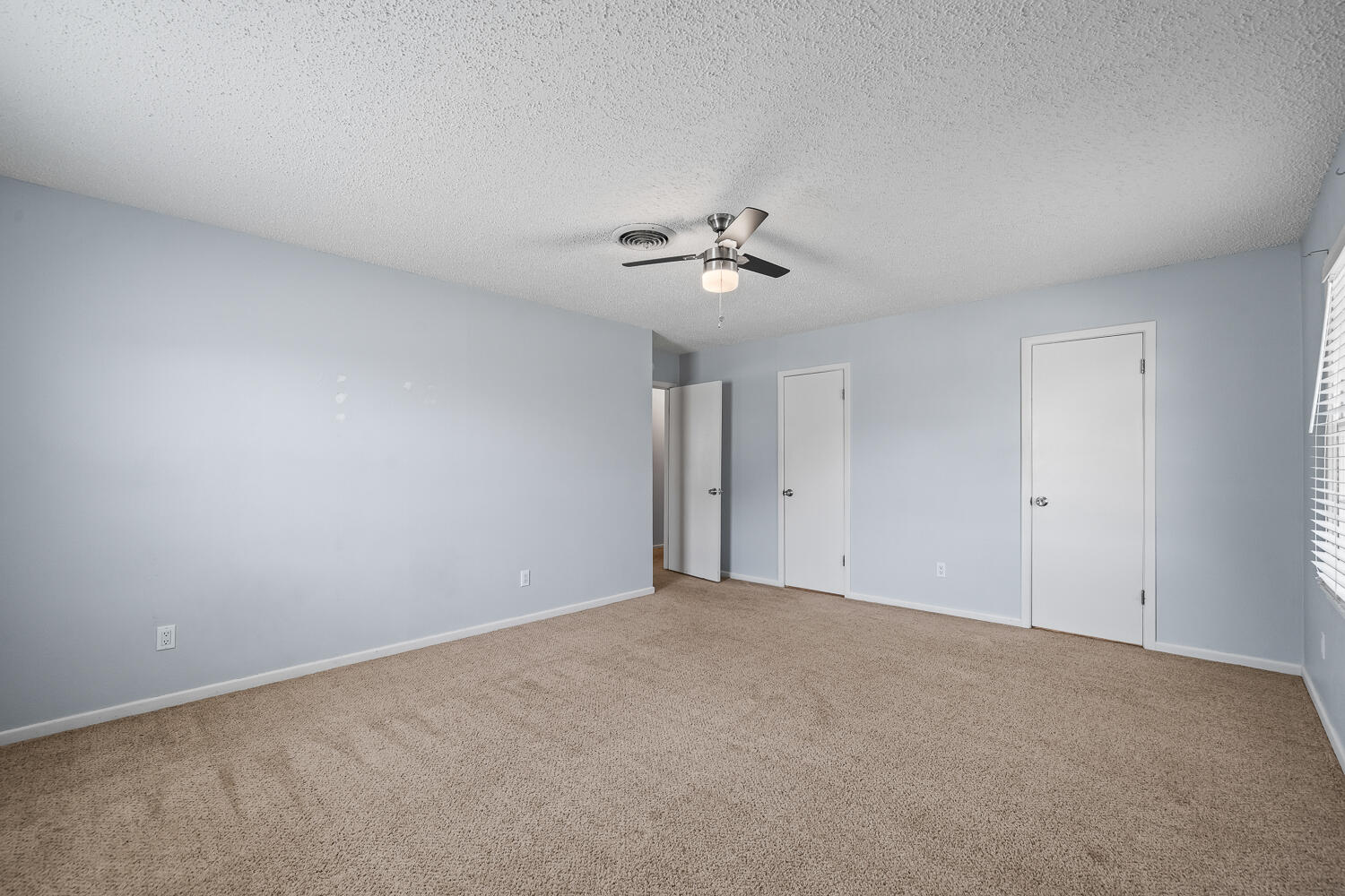 5204 7th Street Lubbock, TX 79416 - Photo 19 of 29 a view of an empty room with a fan