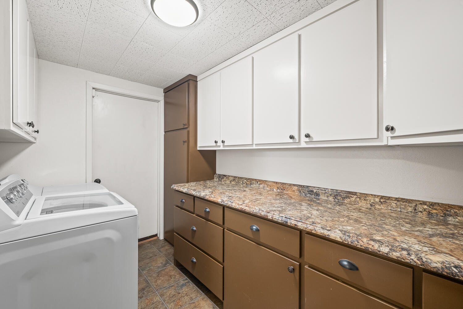 5204 7th Street Lubbock, TX 79416 - Photo 21 of 29 a utility room with sink dryer and washer