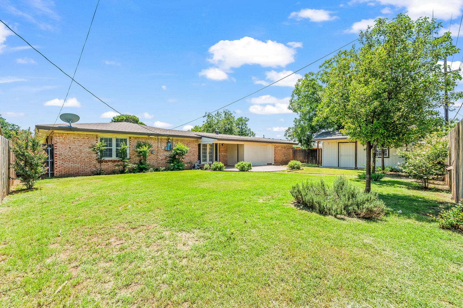 5204 7th Street Lubbock, TX 79416 - Photo 24 of 29 a front view of a house with garden