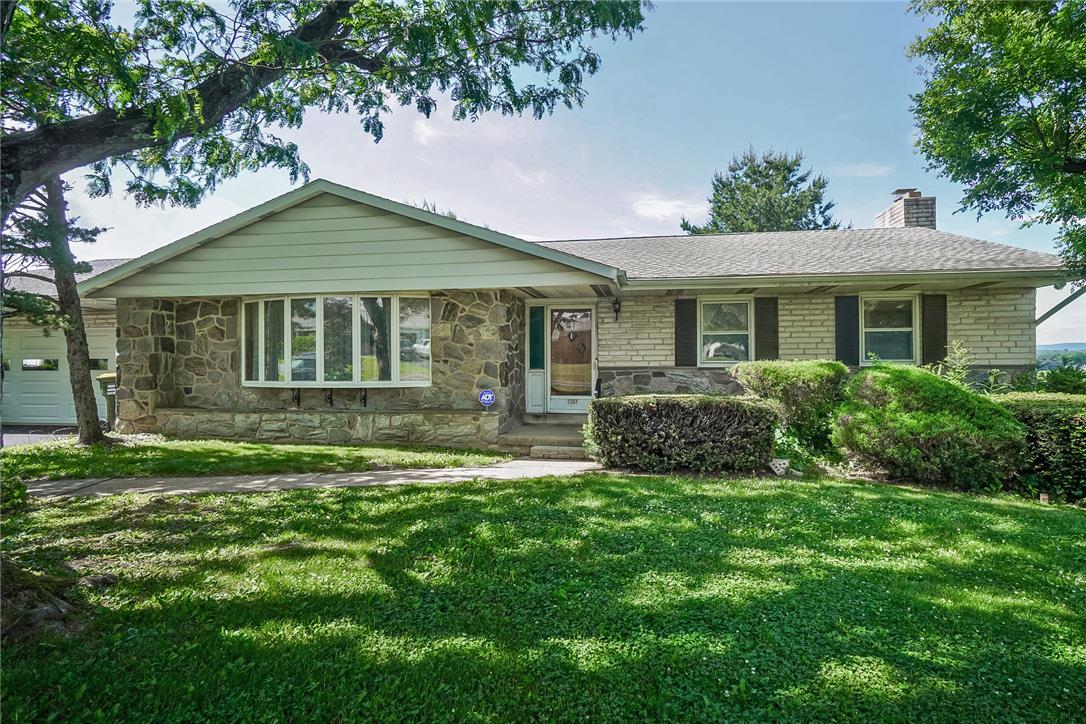 1657 Clearview Road Coplay, PA 18037 - Photo 4 of 77 A classic ranch home showcasing a blend of natural stone and brick with a welcoming entry.