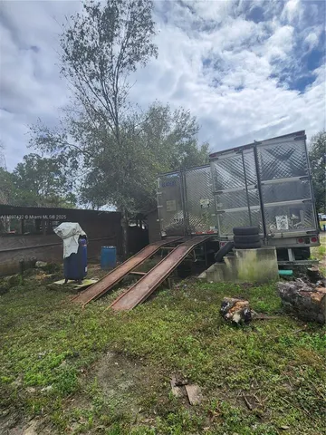 a view of a yard with swimming pool