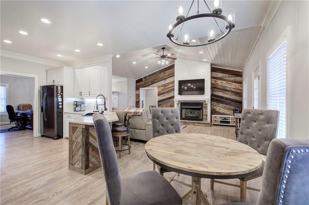 1005 Harmony Road Southeast Aragon, GA 30104 - Photo 12 of 40 a living room with stainless steel appliances kitchen island furniture and wooden floor