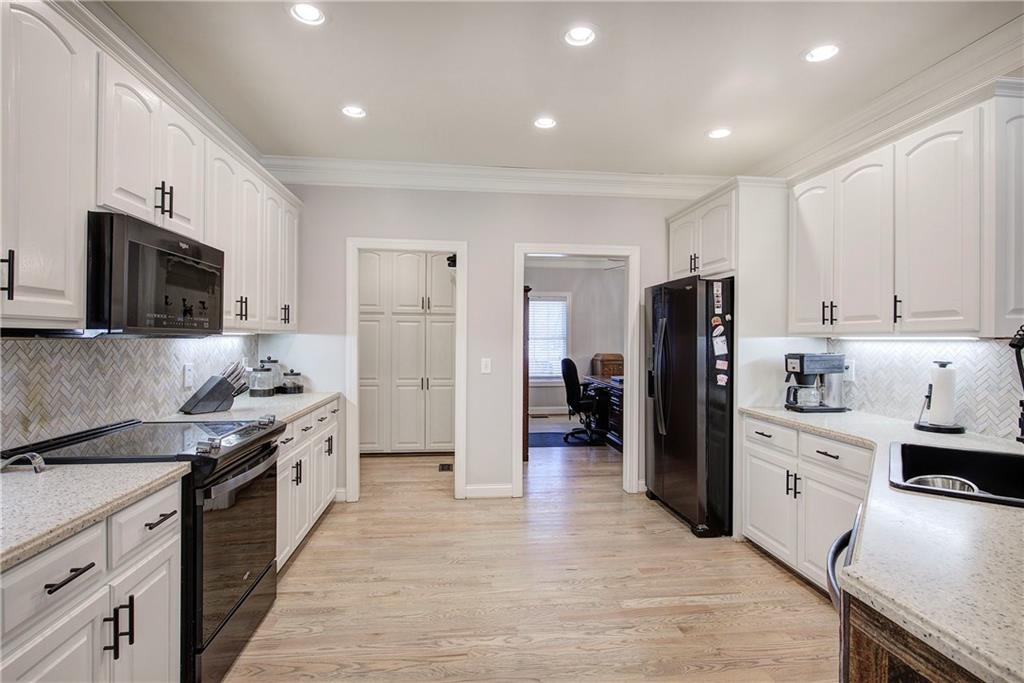 1005 Harmony Road Southeast Aragon, GA 30104 - Photo 16 of 40 a kitchen with stainless steel appliances a refrigerator stove and sink