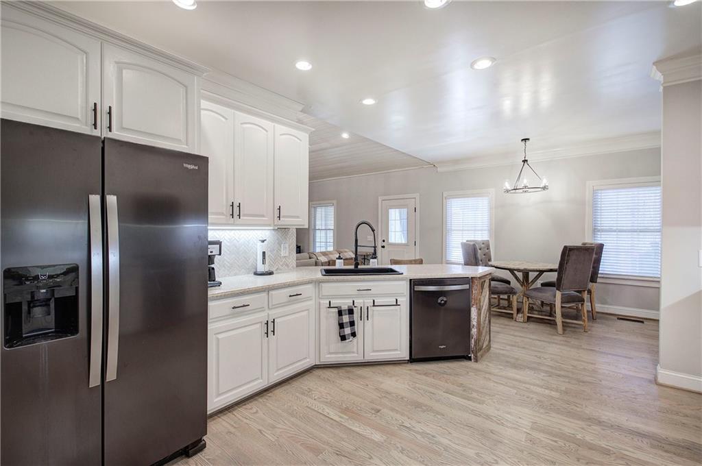 1005 Harmony Road Southeast Aragon, GA 30104 - Photo 18 of 40 a kitchen with a sink stainless steel appliances and cabinets