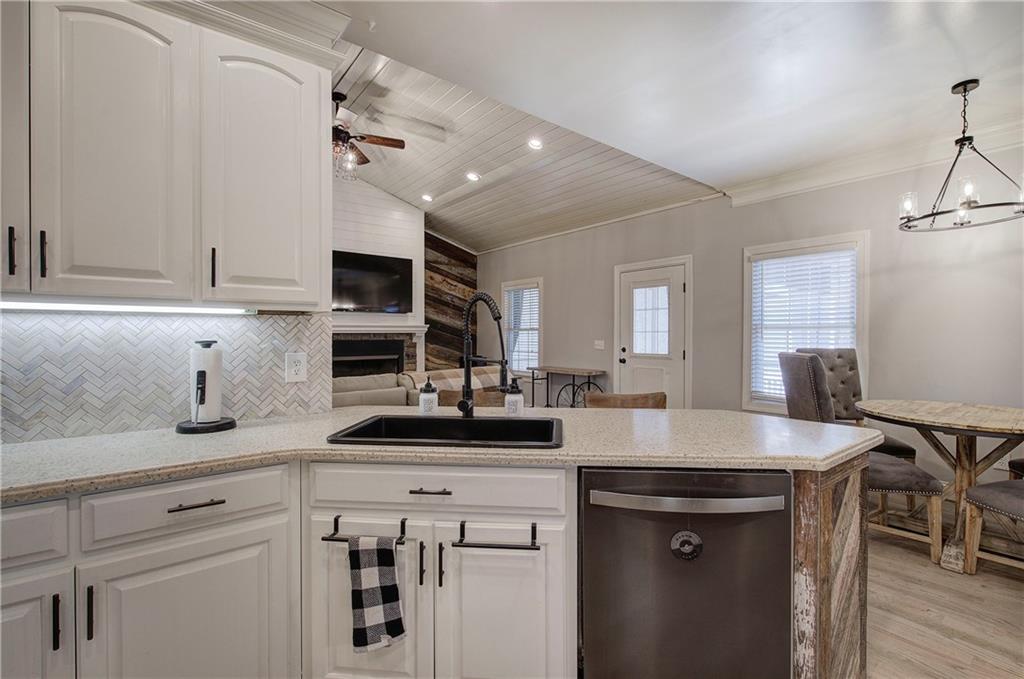 1005 Harmony Road Southeast Aragon, GA 30104 - Photo 20 of 40 a kitchen with a sink stove and cabinets