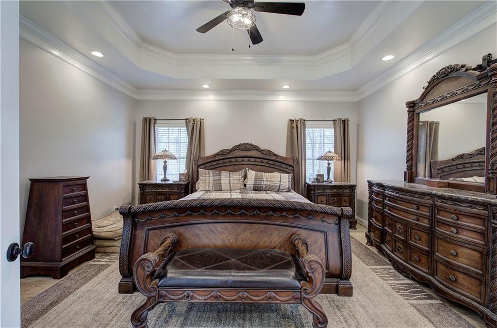 1005 Harmony Road Southeast Aragon, GA 30104 - Photo 24 of 40 a bedroom with a bed and a chandelier