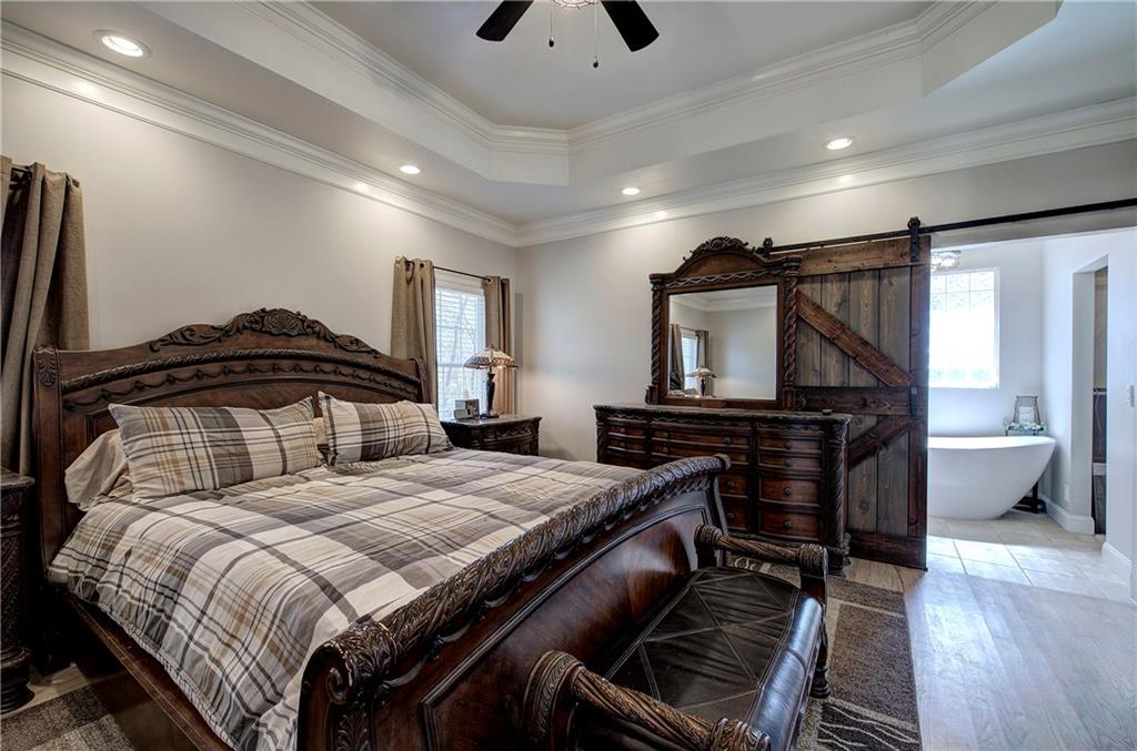 1005 Harmony Road Southeast Aragon, GA 30104 - Photo 25 of 40 a bedroom with a bed and a television