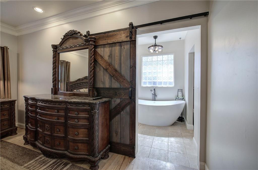 1005 Harmony Road Southeast Aragon, GA 30104 - Photo 26 of 40 a bathroom with a toilet a sink and mirror