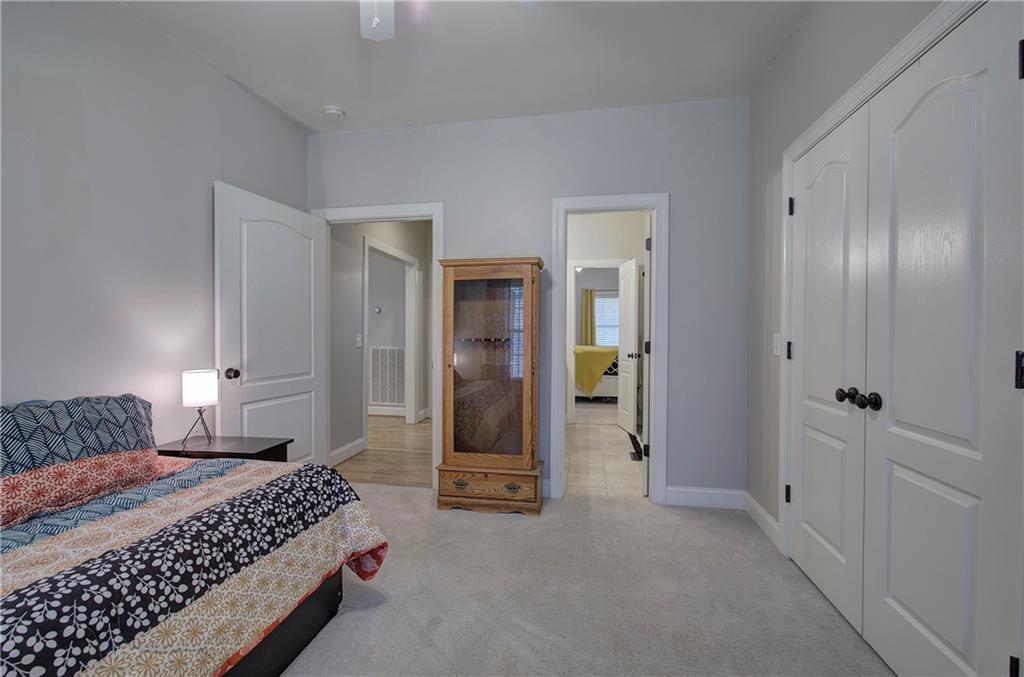 1005 Harmony Road Southeast Aragon, GA 30104 - Photo 39 of 40 a bedroom with a bed and a walk in closet