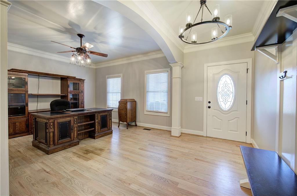 1005 Harmony Road Southeast Aragon, GA 30104 - Photo 7 of 40 a view of a livingroom with furniture a chandelier fan and wooden floor