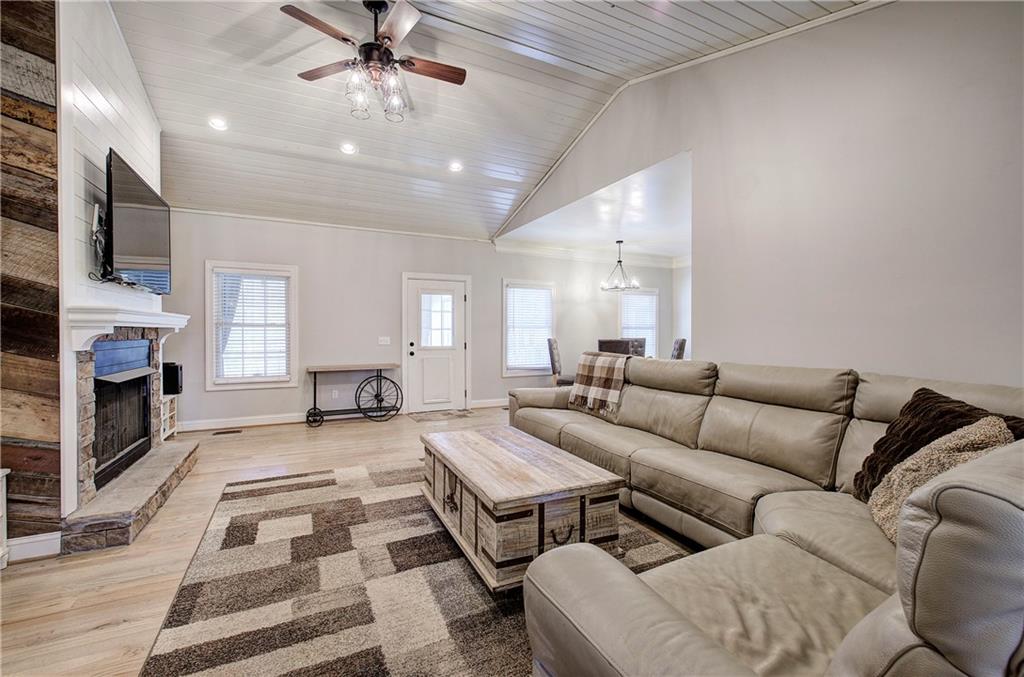 1005 Harmony Road Southeast Aragon, GA 30104 - Photo 8 of 40 a living room with furniture and a fireplace