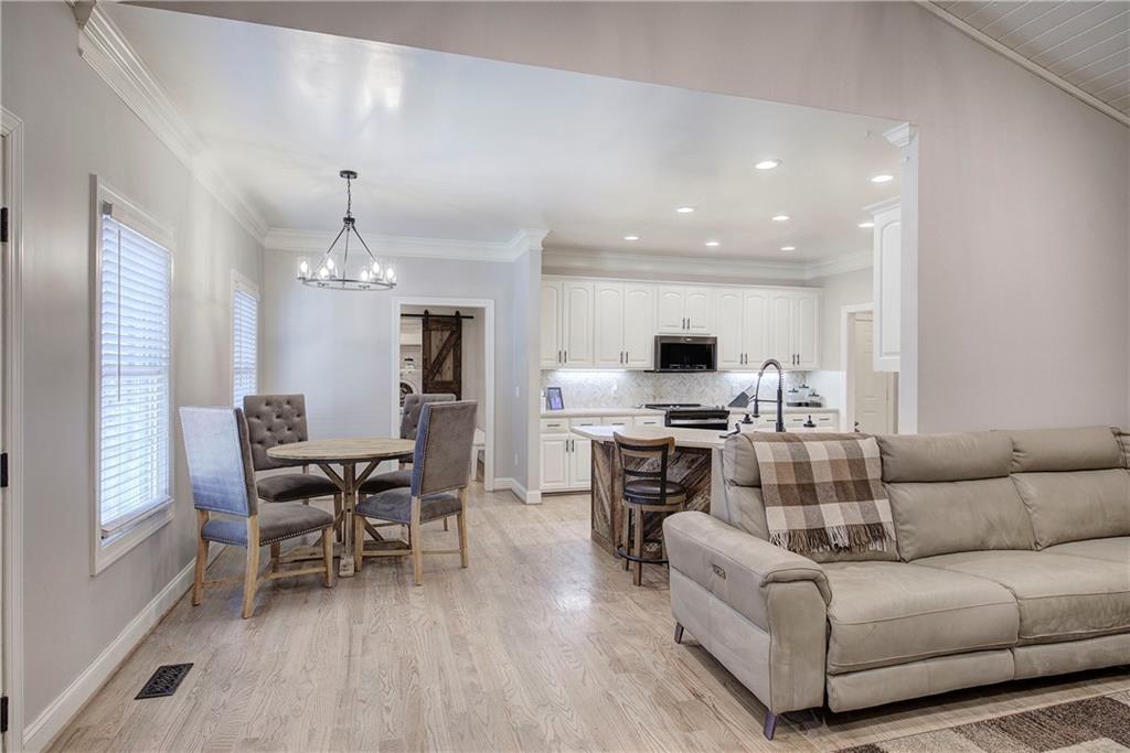 1005 Harmony Road Southeast Aragon, GA 30104 - Photo 9 of 40 a living room with furniture kitchen and a chandelier