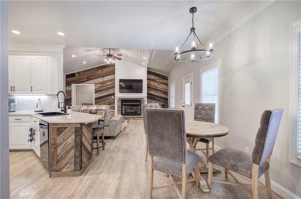 1005 Harmony Road Southeast Aragon, GA 30104 - Photo 10 of 40 a view of a dining room with furniture window and wooden floor